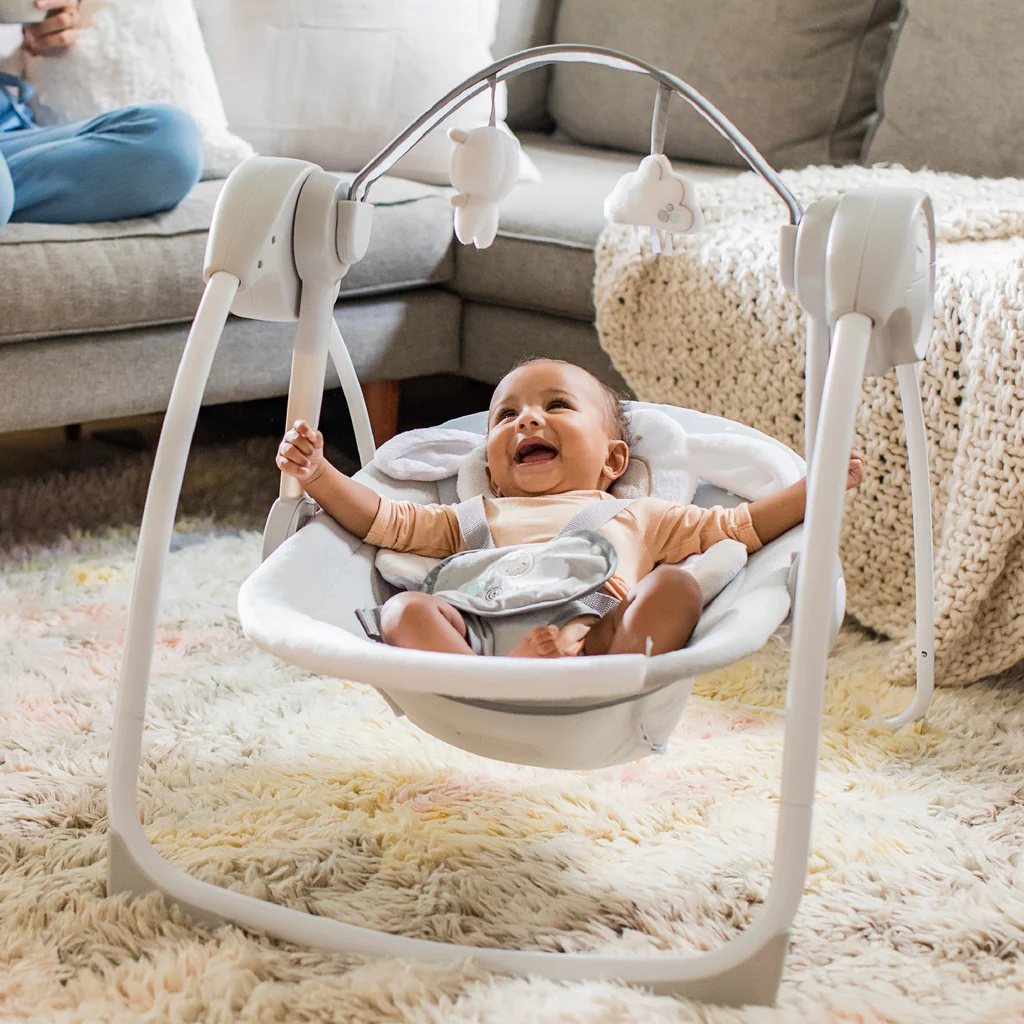 Ingenuity mission showing parent using portable baby swing with infant safe and comfortable demonstrating quality baby products